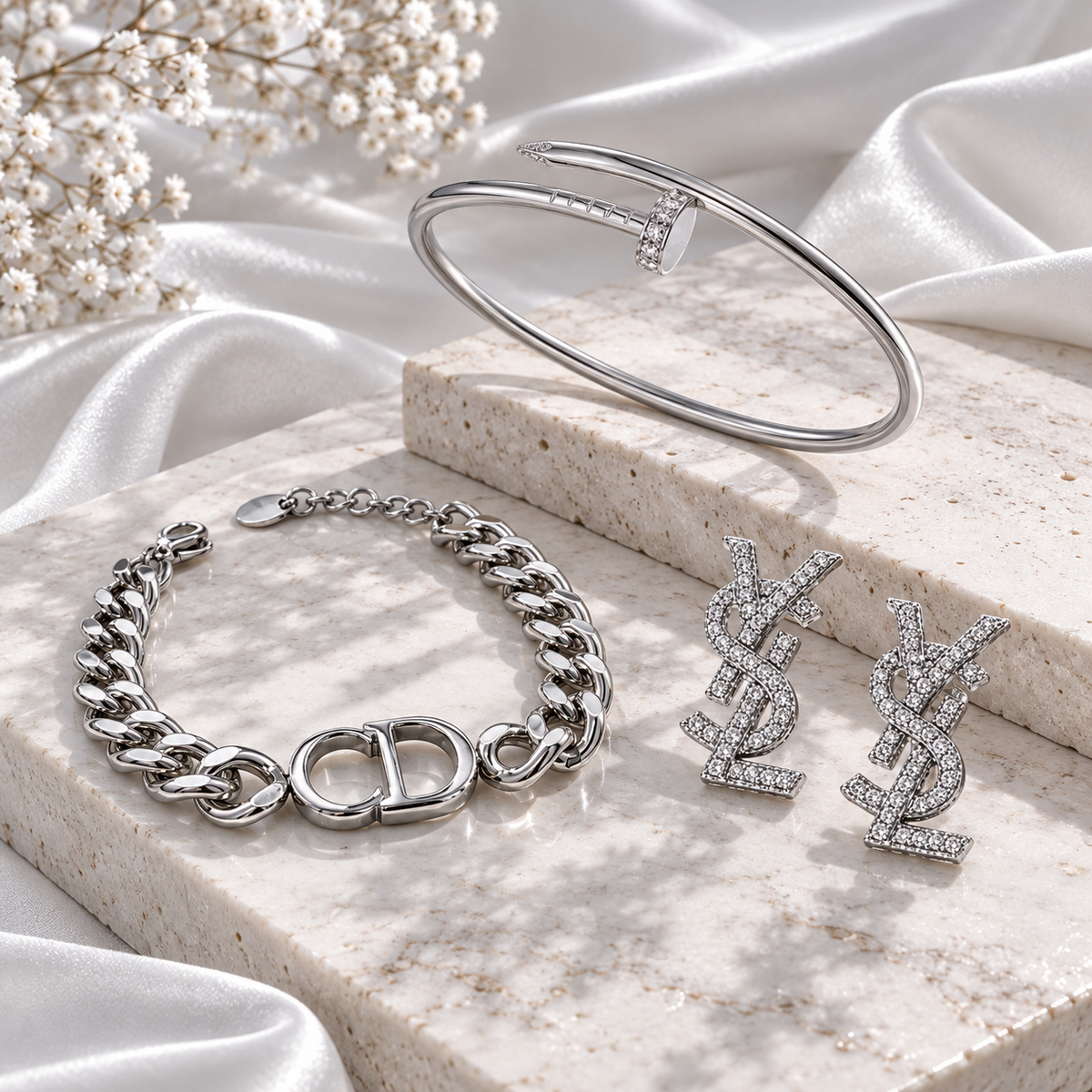 Σετ Dior βραχιόλι Curb, Cartier Juste un Clou, YSL σκουλαρίκια